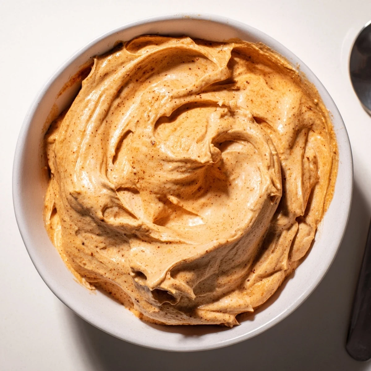 Creamy Spiced Pumpkin Coffee Whip Dip served in a bowl with seasonal cookies.  