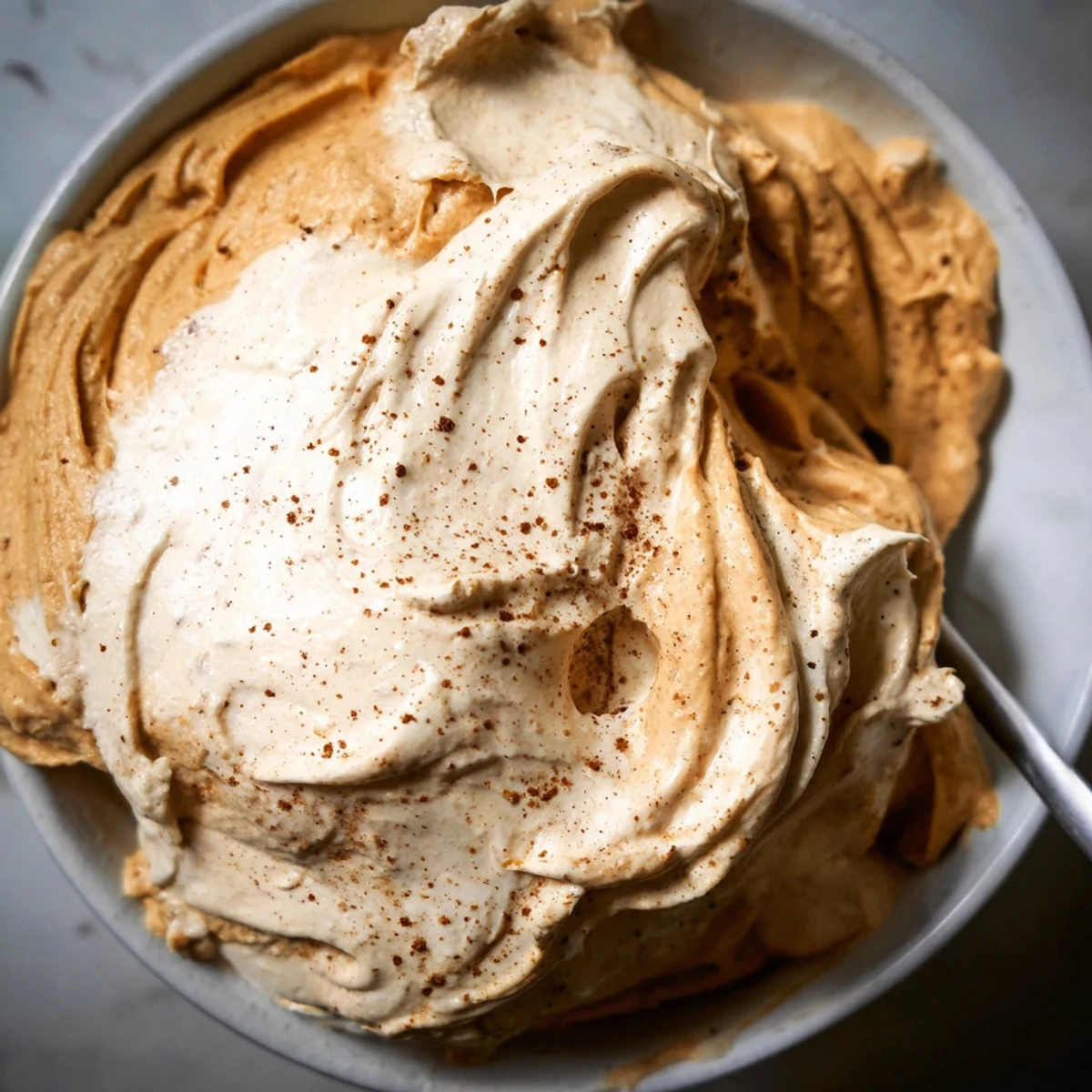 Delicious Spiced Pumpkin Coffee Whip Dip topped with a sprinkle of cinnamon.  