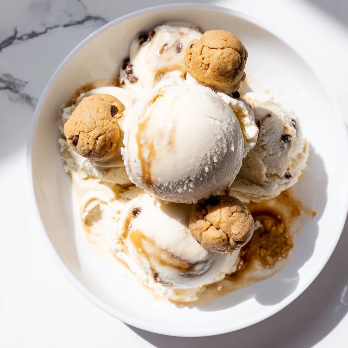 Guilt-free cottage cheese ice cream topped with edible cookie dough, a sweet treat.  