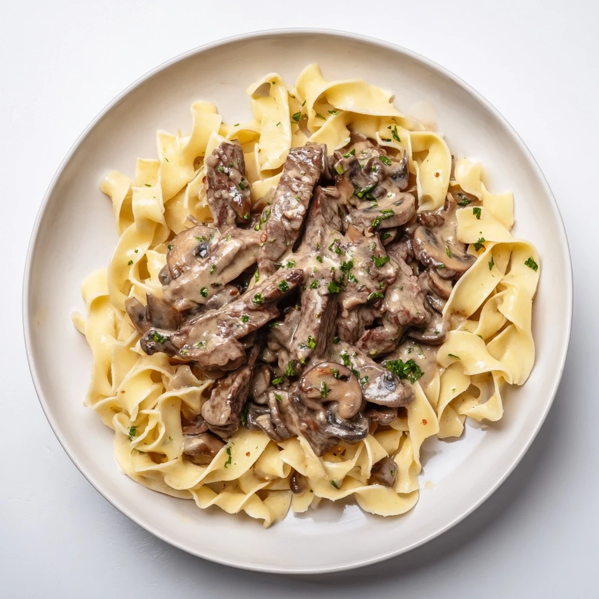 Creamy Mushroom Beef Stroganoff: A rich, beefy and mushroom-filled classic, sitting atop warm, golden egg noodles.