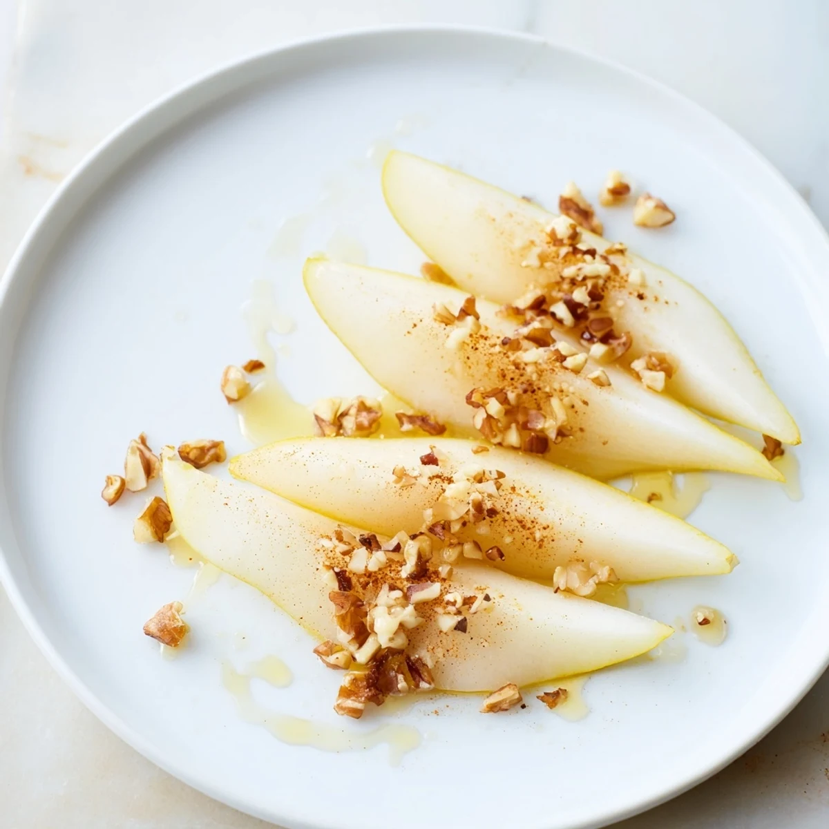 These honey-drizzled pear slices offer a sweet and juicy bite, beautifully arranged for serving.