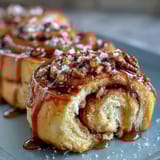 Fluffy crescent dough mini rolls filled with bright orange zest sugar, baked golden and drizzled with citrus glaze.