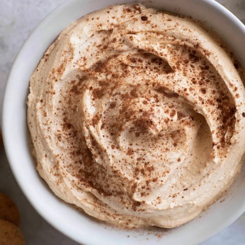 Delightful spiced pumpkin coffee whip dip served with fresh apple slices.  