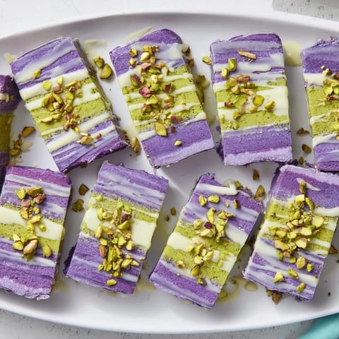 Vibrant ube and pistachio ice cream bars, perfect for summer gatherings and desserts.  