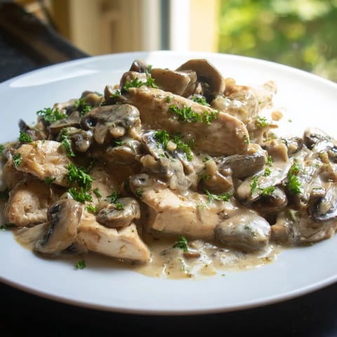 Golden-brown chicken strips simmered in the creamy sauce, this easy Creamy Chicken Stroganoff is tempting.