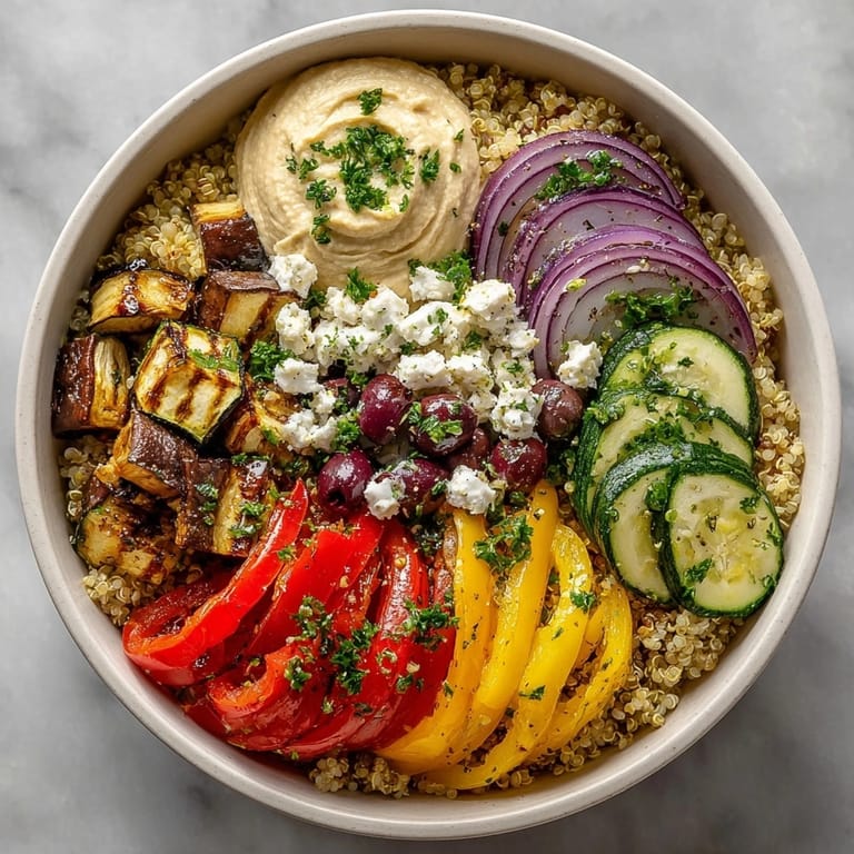 Healthy Mediterranean Quinoa Power Bowl plated for a vibrant vegetarian dinner with fluffy quinoa and olives.