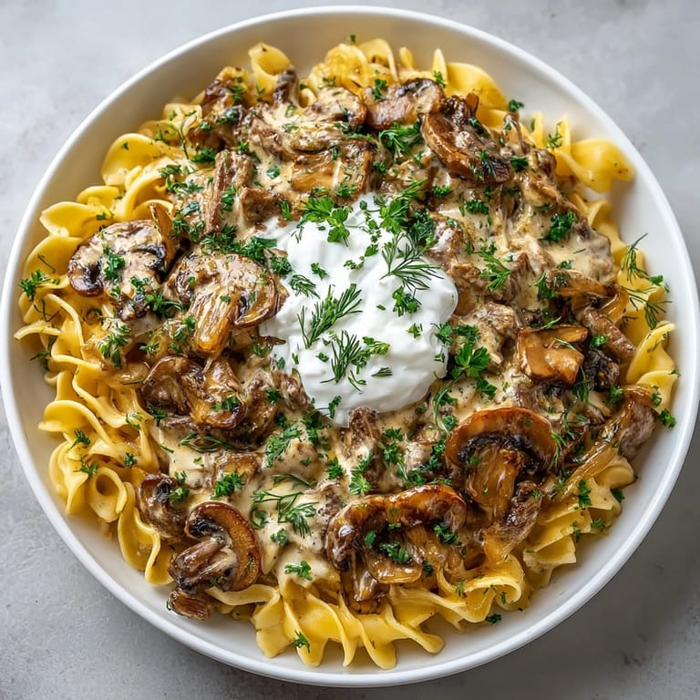 Old-fashioned comfort bowl of classic Beef and Mushroom Stroganoff, perfect for cozy family dinners.