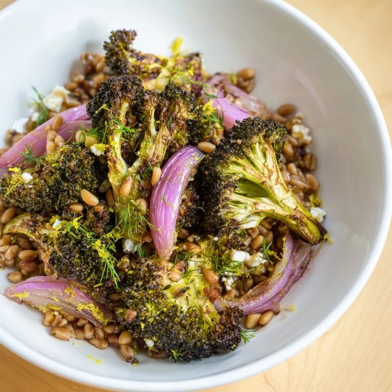 Vibrant image of warm roasted broccoli on farro; a healthy, Mediterranean-inspired dish for dinner.