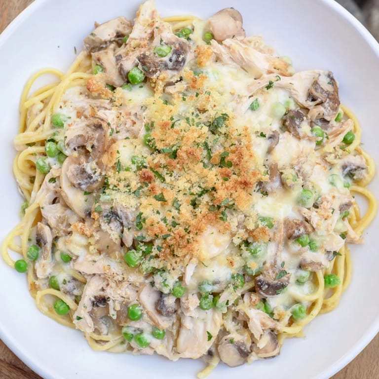 Steaming hot Turkey Tetrazzini features tender turkey and pasta in a rich, white wine sauce.