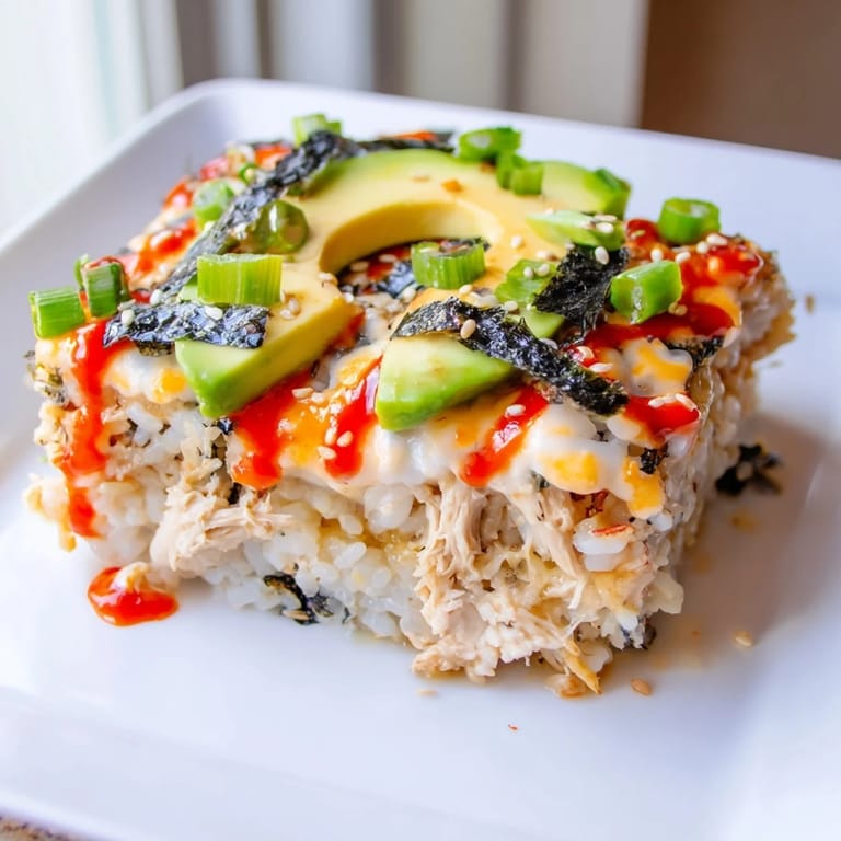 Savory Chicken Sushi Bake with melted mozzarella, showcasing a comforting fusion-style main course.