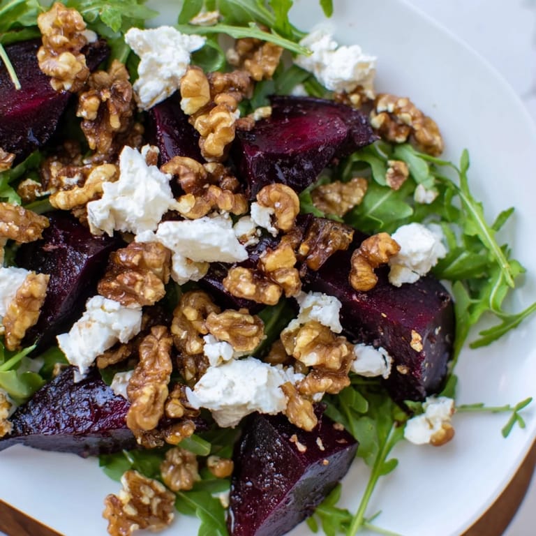 Fresh Roasted Beet Walnut Salad with candied walnuts, drizzled with tangy vinaigrette, ready to serve.