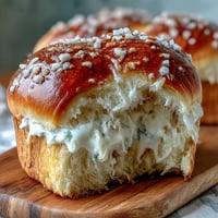 Soft and fluffy Japanese milk bread loaf with golden crust, perfect for sandwiches or toast.  