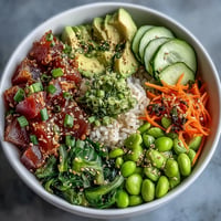 Fresh canned tuna poke bowl bursting with colorful vegetables and zesty dressing.